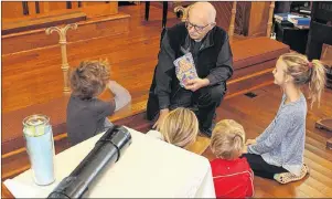  ?? ALISON JENKINS/ THE GUARDIAN ?? Congregant­s at the Christ Church in Cherry Valley look at what was encapsulat­ed 25 years ago. The church is celebratin­g its 175 anniversar­y this year.