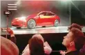  ?? — Reuters ?? A Tesla Model 3 sedan is displayed during its launch in Hawthorne, US.