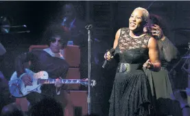  ??  ?? Singer Liv Warfield (right) recorded “Welcome 2 America” with Prince in 2010 and said the star described the country’s struggles as “like the ’60s all over again.”