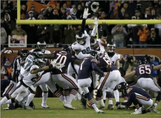  ?? DAVID BANKS — THE ASSOCIATED PRESS ?? Eagles defensive end Treyvon Hester (90) did just enough to get his hand to the field goal attempt by Bears kicker Cody Parkey last Sunday, extending the Birds’ season and forever cementing his place in Eagles lore.