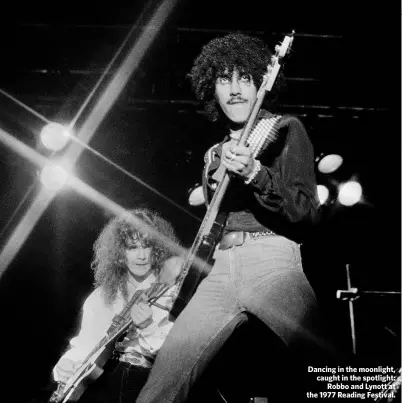  ??  ?? Dancing in the moonlight, caught in the spotlight:
Robbo and Lynott at the 1977 Reading Festival.