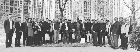  ??  ?? The Sarawak delegation posing for a photograph in front of the community complex in Qingdao yesterday.