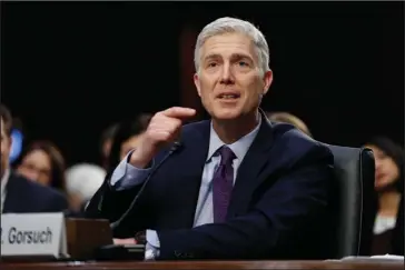  ?? The Associated Press ?? CONFIRMATI­ON HEARING: Supreme Court Justice nominee Neil Gorsuch testifies Tuesday on Capitol Hill in Washington at his confirmati­on hearing before the Senate Judiciary Committee.