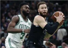  ?? MICHAEL DWYER - THE ASSOCIATED PRESS ?? This Feb. 13, 2019, file photo shows Boston Celtics’ Jaylen Brown (7) defending against Detroit Pistons’ Blake Griffin (23) during the second half of an NBA basketball game in Boston.