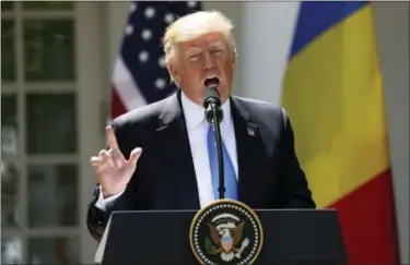  ?? ANDREW HARNIK- THE ASSOCIATED PRESS ?? President Donald Trump speaks during a news conference with Romanian President Klaus Werner Iohannis, in the Rose Garden at the White House, Friday.