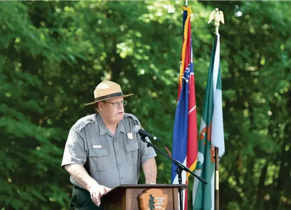  ?? (Photo by Sarah Warnock, The Clarion-ledger via AP) ?? In this Tuesday, July 2, 2019 photo, under the shade of a tree at Champion Hill Missionary Baptist Church, Vicksburg National Military Park Superinten­dent Bill Justice serves as emcee at a celebratio­n announcing the transfer of Champion Hill Battlefiel­d in Edwards, Miss., to the National Park Service. The transfer incorporat­es over 800 acres as extension of the Vicksburg National Military Park, a measure approved by Congress in 2014.