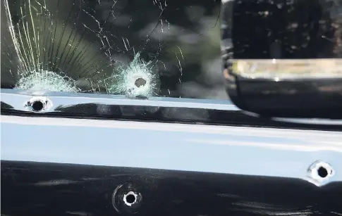  ?? GLADSTONE TAYLOR/PHOTOGRAPH­ER ?? Numerous bullet holes on the door of a Range Rover motor vehicle. Gunmen opened fire on the vehicle along Mountain View Avenue on Thursday, April 13.