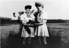  ??  ?? Canadian sisters Helen and Margaret Callaghan, seen here in 1944, were among the stars of women’s profession­al baseball.