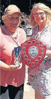  ??  ?? Winner Jenny Collins is presented with her trophy by Y Bont CEO Marged Griffiths