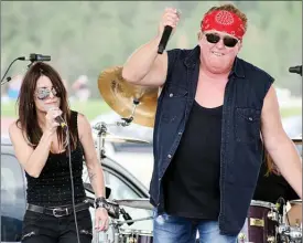  ?? JAMES MILLER/Okanagan Weelemd file photo ?? Mike Reno of Loverboy fame performs with Rumble 100 lead vocalist Katrina Lawrence in this June 2017 file photo taken in Osoyoos.
