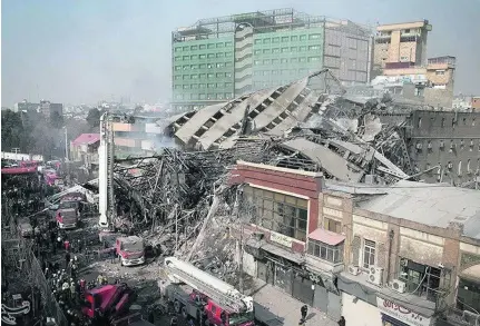  ?? Reuters ?? The fire appeared to be most intense in the building’s upper floors, home to garment workshops where tailors use old kerosene heaters.