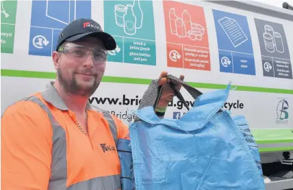 ??  ?? Blue fabric bags for plastics and metals are among the recycling containers now used in Bridgend County Borough