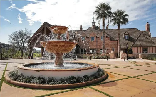  ?? Photos by Kin Man Hui / Staff photograph­er ?? A fountain flows at the front of the Red Berry estate. Past two grand gates with the initials “RB” — part of the estate’s original main entrance — is a circular drive leading to the entrance.