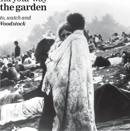  ?? THE ASSOCIATED PRESS ?? A couple hugs during the Woodstock Music and Art Festival in Bethel, N.Y. in 1969.
