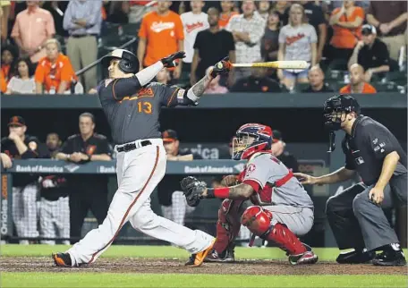  ?? Patrick Semansky Associated Press ?? THE THIRD HOME RUN of the night for Manny Machado was the biggest, a walk-off grand slam against Keynan Middleton in ninth.