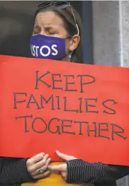  ??  ?? Supporters pray against the deportatio­n of Aguilar, a carpenter and father of three U.S.born children.