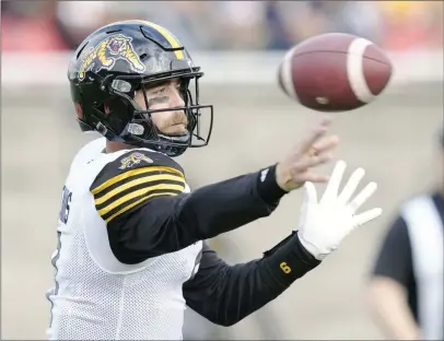  ?? ?? The Canadian Press
Hamilton Tiger-Cats quarterbac­k Dane Evans makes a pass during CFL Eastern semifinal football action in Montreal. The Hamilton Tiger-Cats traded former starting quarterbac­k Dane Evans to the B.C. Lions on Thursday.