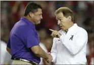  ?? BRYNN ANDERSON - THE ASSOCIATED PRESS ?? FILE - In this Nov. 4, 2017, file photo, LSU head coach Ed Orgeron, left, and Alabama head coach Nick Saban meet in the center of the field before a game, in Tuscaloosa, Ala.