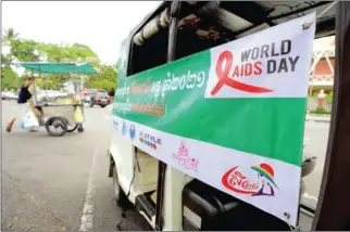  ?? HONG MENEA ?? A banner to observe World AIDS Day in Phnom Penh in 2021.