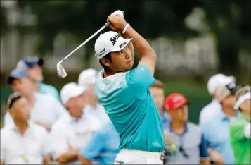  ?? ASSOCIATED PRESS PHOTOS ?? HIDEKI MATSUYAMA WATCHES HIS TEE SHOT ON THE 17TH HOLE Hollow Club on Friday in Charlotte, N.C. during the second round of the PGA Championsh­ip at the Quail