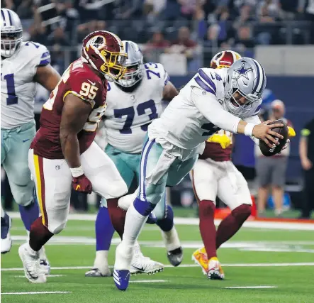  ?? RON JENKINS / THE ASSOCIATED PRESS ?? Dallas quarterbac­k Dak Prescott dives for a touchdown against the Washington on Thursday. The Cowboys have beaten the rival Redskins in eight of nine Thanksgivi­ng meetings.