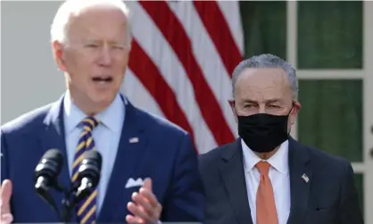  ?? Photograph: Alex Wong/Getty Images ?? President Joe Biden speaks during a news conference as the Senate majority leader, Chuck Schumer, listens.