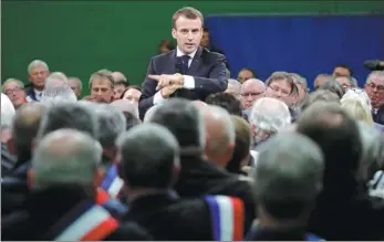  ?? PHILIPPE WOJAZER / REUTERS ?? French President Emmanuel Macron delivers a speech during a meeting with mayors from rural Normandy as part of the launch of the “Great National Debate” designed to find ways to calm social unrest in the country, in Grand Bourgthero­ulde, France, on Tuesday.