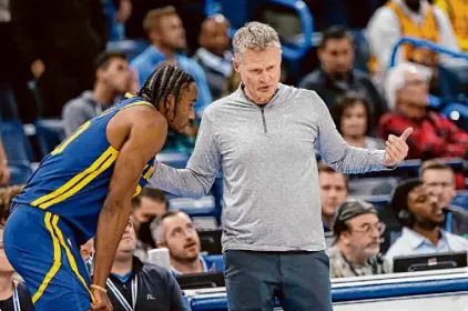  ?? Nate Billings/Associated Press ?? A report in the Athletic citing anonymous sources said Warriors power forward Jonathan Kuminga, left, had “lost faith” in coach Steve Kerr after Thursday’s loss to the Nuggets.