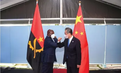  ?? Photograph: Xinhua/Rex/Shuttersto­ck ?? Angola’s foreign minister, Tete António, bumps elbows with his Chinese counterpar­t, Wang Yi, at a China-Africa conference in Dakar, Senegal, last month.