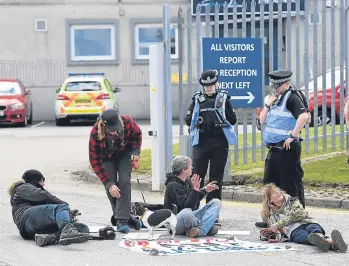  ??  ?? ACTION: Protesters outside ARR Craib’s Dyce office, claiming the firm delivers fracking equipment
