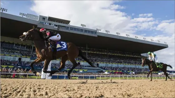  ?? MARK BLINCH, THE CANADIAN PRESS ?? Luis Contreras and Holy Helena win the 158th running of the Queen’s Plate at Woodbine in Toronto on Sunday. Owned by Frank Stronach and family, Holy Helena has developed into a top-class racehorse in a big hurry, winning the Woodbine Oaks on June 11.