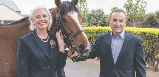 ?? JOINING FORCES: Tabcorp chairman Paula Dwyer and Tatts chairman Harry Boon. ??