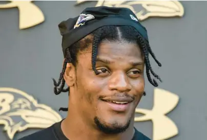  ?? KIM HAIRSTON/BALTIMORE SUN ?? Baltimore Ravens QB Lamar Jackson answers questions after practice at the Under Armour Performanc­e Center on Wednesday afternoon.