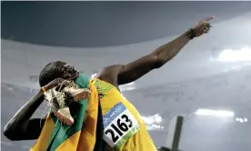  ?? Photograph: Michael Kappeler/AFP/Getty Images ?? Usain Bolt celebrates winning the men’s 200m final at the Bird’s Nest stadium during the 2008 Beijing Olympic Games on 20 August 2008.