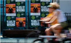  ?? June. Photograph: Martin Meissner/AP ?? Posters show Sultan Al Jaber, the president of Cop28, at a bus stop in Bonn, Germany, in