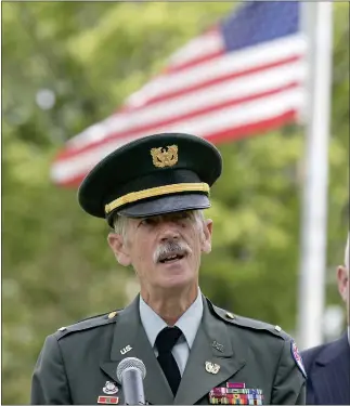  ?? JOHN LOVE PHOTOS / SENTINEL & ENTERPRISE ?? U.S. Army Garrison Fort Devens Command Team held a Memorial Day ceremony on Thursday to remember and honor the brave men and women who fought for our country. The ceremony was held at the Fort Devens Post Cemetery. Addressing the crowd at the ceremony is Chief Warren Officer Walter Mann, honoring those who ‘were giving us the freedom to stand here today.’