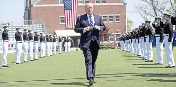  ??  ?? NEW LONDON, Connecticu­t: US President Donald Trump arrives at a US Coast Guard Academy commenceme­nt ceremony yesterday. — AFP