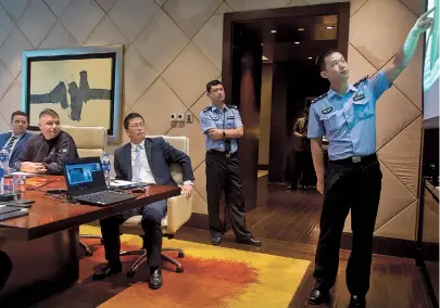  ??  ?? Officer Yu Qijie gives a talk to workers of the Jing’an Shangri-La Hotel. — Zhou Shengjie