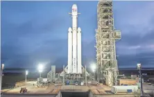  ?? VIA AP SPACEX ?? The SpaceX Falcon Heavy rocket will be capable of lifting super-size satellites into orbit and sending spacecraft to the moon, Mars and beyond.