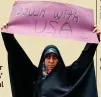  ??  ?? A protester in Tehran vents her disapprova­l of the United States’ withdrawal from the Iran nuclear deal