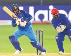  ?? Virendra Saklani/Gulf News ?? Indian opener Lokesh Rahul flicks the ball off his pads during the half-century against Afghanista­n in the Unimoni Asia Cup 2018 at Dubai Internatio­nal Stadium on Tuesday.