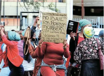  ?? Picture: LULAMILE FENI ?? PROTEST: A group of women picket outside the Mthatha magistrate’s court on Monday to voice opposition to bail for Avumile Mbuyiseni Nodongwe, the man accused of killing his ex-girlfriend, Noloyiso Gengqa.