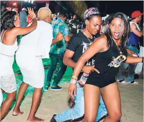  ??  ?? These patrons were certainly enjoying themselves at Arctic, held at Chances Beach, Negril.