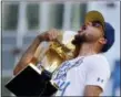  ?? MARCIO JOSE SANCHEZ — THE ASSOCIATED ?? Warriors’ Stephen Curry shouts as he carries the Larry O’BrienPRESS trophy during the team’s NBA championsh­ip parade, Tuesday in Oakland.