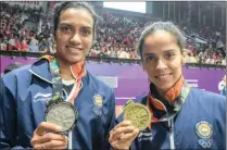  ??  ?? NATION’S PRIDE: PV Sindhu and Saina Nehwal, shone in the current Asian Games when they took silver and bronze in the women’s badminton singles.