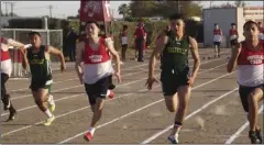  ?? KARINA LOPEZ PHOTO ?? Runners from Imperial and Holtville Highs compete in the boys’ 100-meter dash during a meet at Imperial High on Thursday. Imperial’s Rudy Avila (far right) ran away with the win.