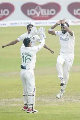  ??  ?? Bangladesh’s Abu Jayed (right) celebrates with teammates the dismissal of West Indies batsman Kyle Mayers.