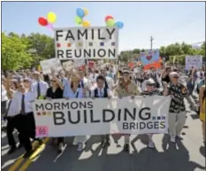  ?? AP Photo ?? In this June 2, 2013, file photo, members of the Mormons Building Bridges march during the Utah Gay Pride Parade in Salt Lake City.
