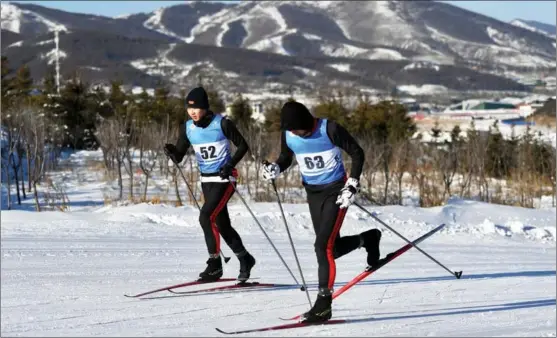  ?? PHOTOS BY WEI XIAOHAO / CHINA DAILY ?? The newly built National Cross-Country Center (above) and the National Ski Jumping Center (below) enter the final stage of preparatio­ns for the 2022 Winter Olympics by hosting domestic competitio­ns and winter sports promotiona­l activities in the Chongli district of Zhangjiako­u, Hebei province.