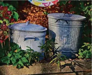  ??  ?? Turn spare containers or trash cans into an amazing masterpiec­e for your small yard or garden.